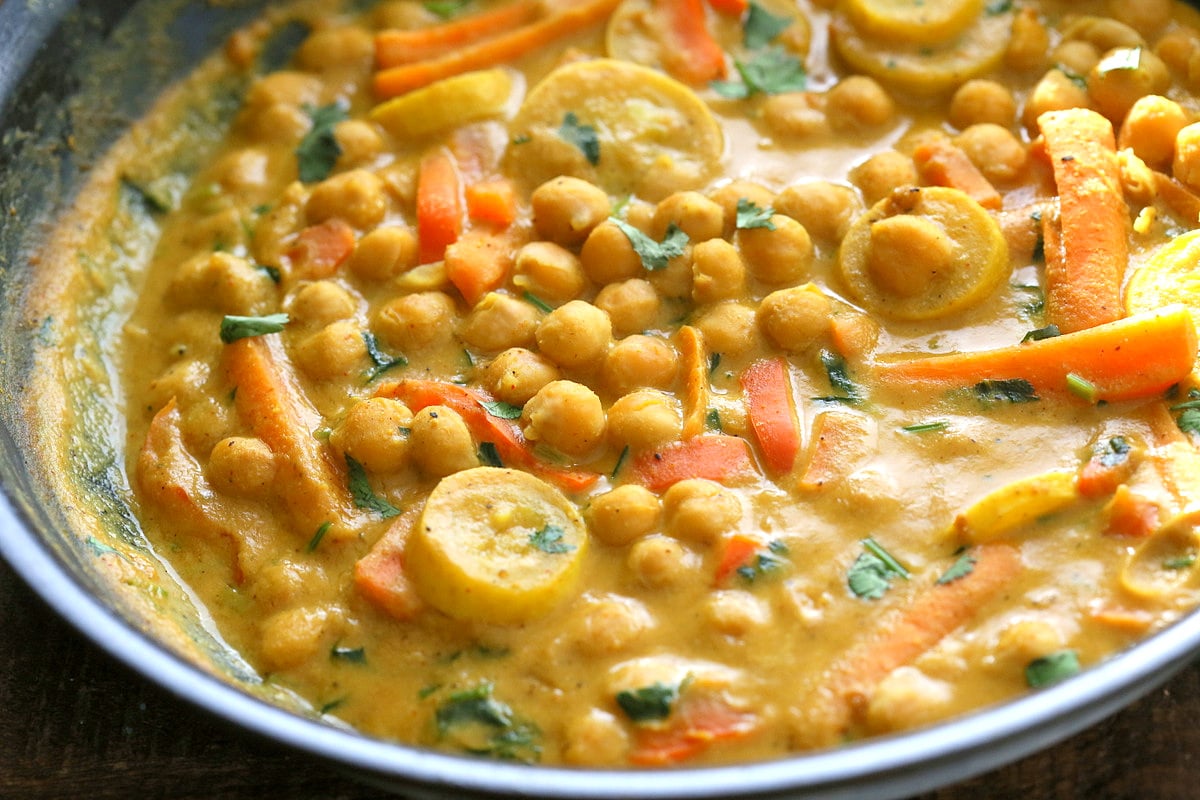 Chickpeas in Turmeric Peanut Butter Curry. Easy Nut Butter Curry Sauce with Summer veggies and Chickpeas. Vegan Gluten-free Soyfree Recipe | VeganRicha.com