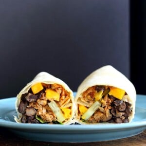 Jamaican Jerk Jackfruit Caribbean Black Bean Mango Wraps. These Burritos are packed with hot shredded jerk jackfruit, black beans, mango and cucumbers. Serve as wraps or make a sandwich or bowl. Vegan Soy-free Recipe. Can be gluten-free | VeganRicha.com #vegan #glutenfree #veganricha