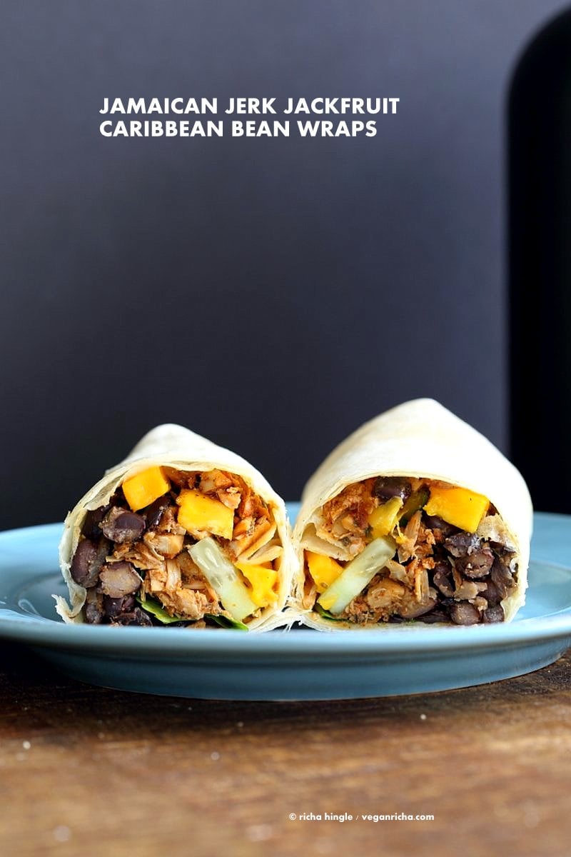 Jamaican Jerk Jackfruit Caribbean Black Bean Mango Wraps. These Burritos are packed with hot shredded jerk jackfruit, black beans, mango and cucumbers. Serve as wraps or make a sandwich or bowl. Vegan Soy-free Recipe. Can be gluten-free | VeganRicha.com