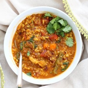 Lentil Brown Rice Soup. Easy 1 pot Lentil Rice Soup with Spinach or greens of choice. 20 minutes active time then let everything simmer. Serve with crackers, papadum or grilled vegan cheese sandwiches. Vegan Gluten-free Soy-free Recipe | VeganRicha.com #vegan #glutenfree #veganricha