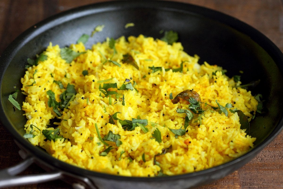 Turmeric Lemon Rice Recipe. Golden Rice with turmeric, lemon and mustard seeds. Use cooked brown rice, quinoa or millet or couscous for variation. Easy side. Vegan Gluten-free Soy-free Recipe | VeganRicha.com