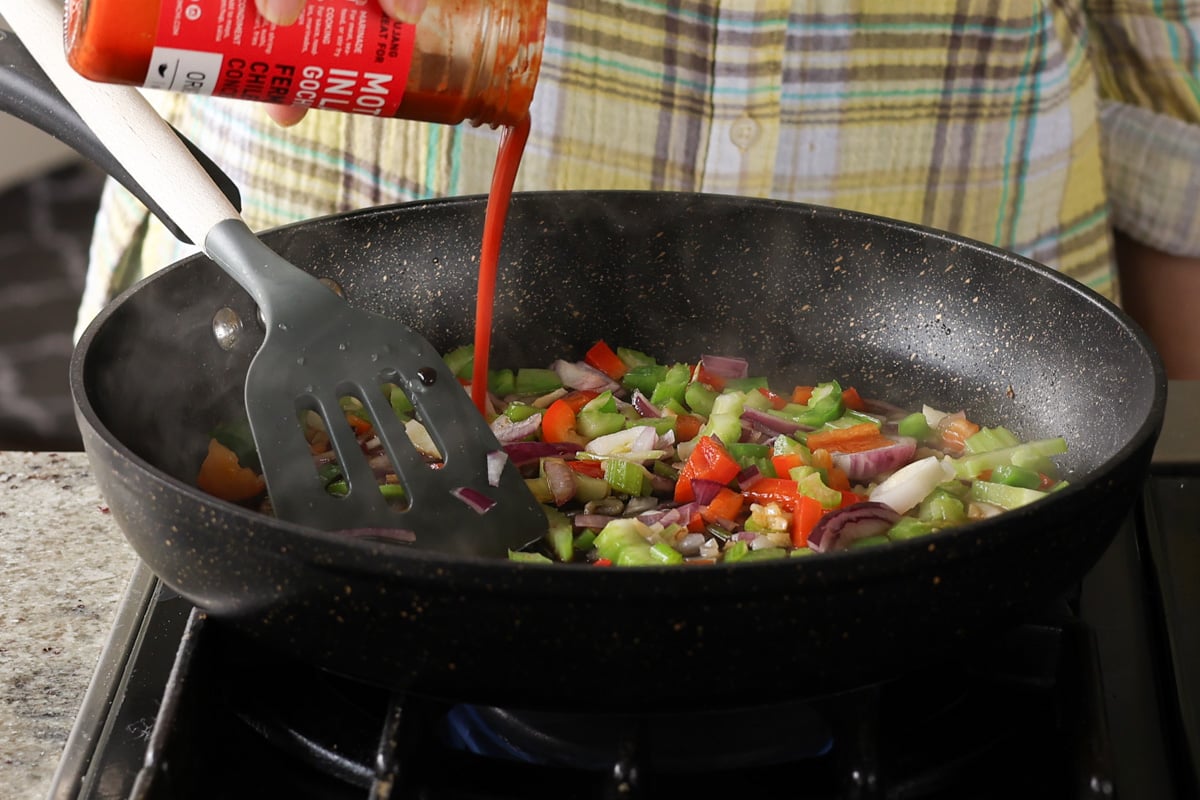 adding gochujang to the pan
