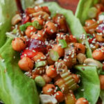 close-up of gochujang chickpeas lettuce wraps on the cutting board