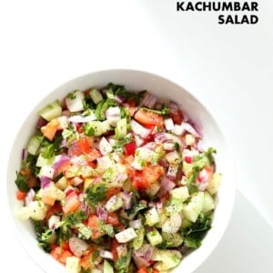 Kachumber Salad - Cucumber Tomato Onion Salad Recipe. Kachumbar is a simple chopped Summer Salad with chopped onions, tomatoes, cucumbers and a salt pepper lemon dressing. Serve as a side with Indian curries, or as a dip with chips, or over burgers. Vegan Gluten-free Soy-free Oil-free Recipe | VeganRicha.com #vegan #glutenfree #veganricha
