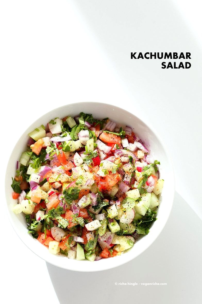 Kachumber Salad - Cucumber Tomato Onion Salad Recipe. Kachumbar is a simple chopped Summer Salad with chopped onions, tomatoes, cucumbers and a salt pepper lemon dressing. Serve as a side with Indian curries, or as a dip with chips, or over burgers. Vegan Gluten-free Soy-free Oil-free Recipe | VeganRicha.com