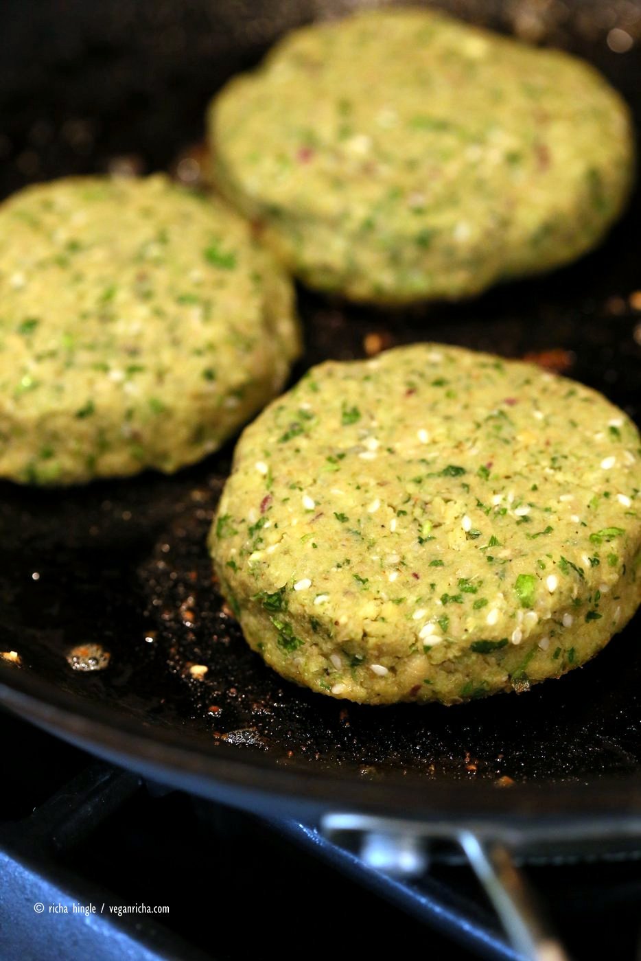 Easy Vegan Falafel Burger. Chickpea patties with tahini dressing and hummus make for a filling and flavorful burger. Vegan Soy-free Recipe. Can be made gluten-free | VeganRicha.com