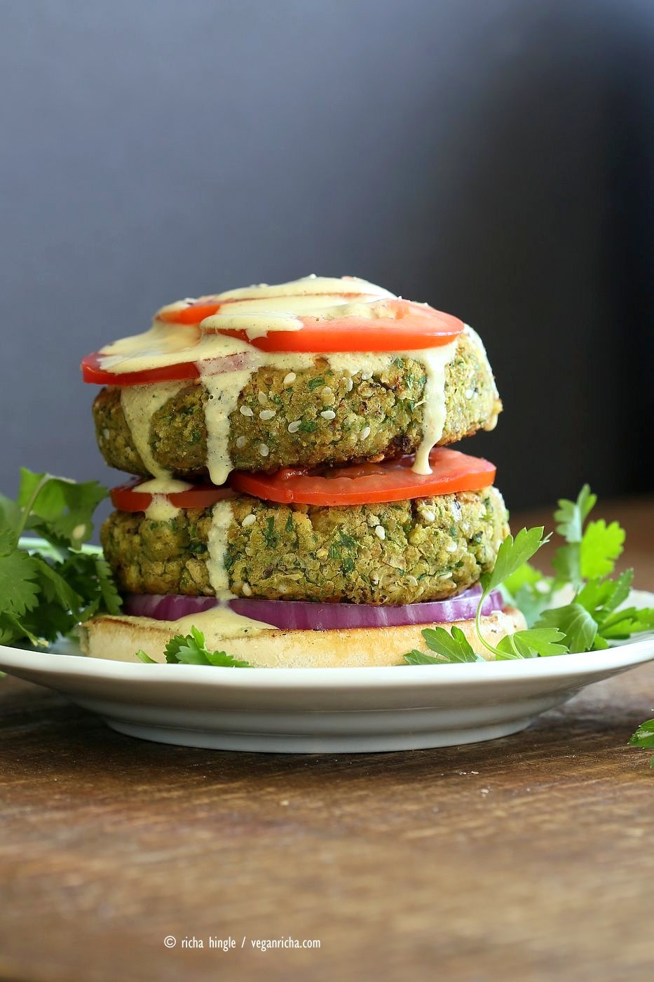 Easy Vegan Falafel Burger. Chickpea patties with tahini dressing and hummus make for a filling and flavorful burger. Vegan Soy-free Recipe. Can be made gluten-free | VeganRicha.com