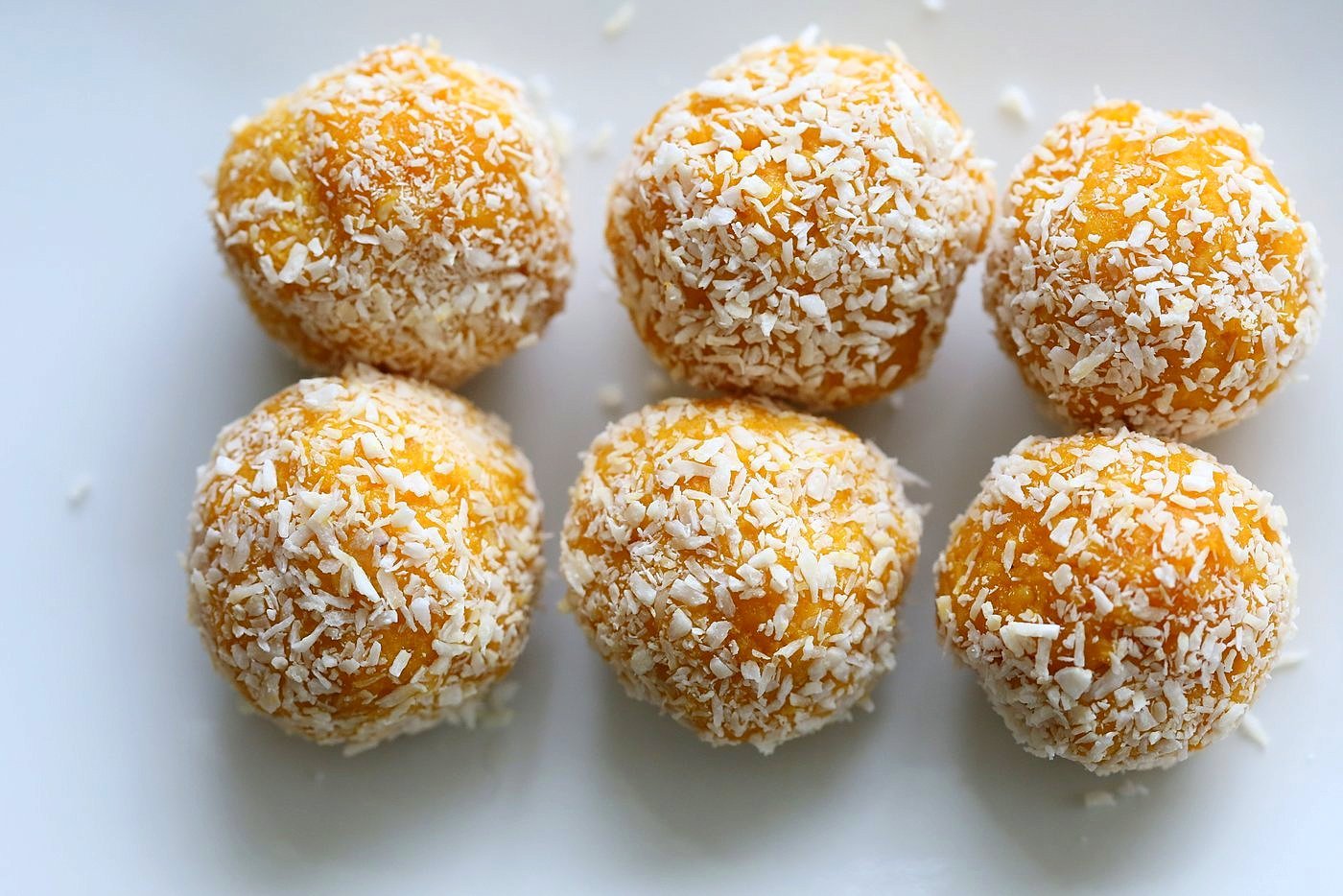 Mango Coconut Ladoo. Fudgy balls made with Mango Puree, Coconut and almond meal. Vegan gluten-free recipe. | VeganRicha.com