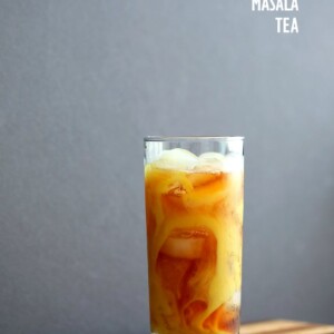 Cardamom Cinnamon Turmeric Iced Tea. Spiced Iced tea like Thai Iced tea with turmeric coconut milk and Indian masala chai spices and ginger. Golden Milk Iced Tea. Vegan Gluten-free Soy-free Recipe | VeganRicha.com #vegan #glutenfree #veganricha
