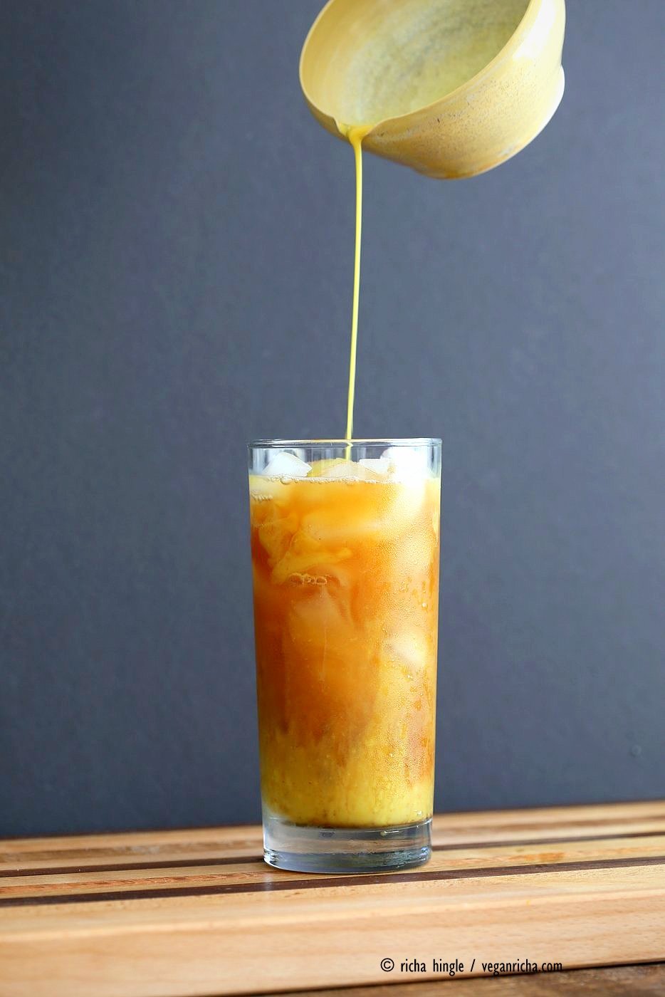 Cardamom Cinnamon Turmeric Iced Tea. Spiced Iced tea like Thai Iced tea with turmeric coconut milk and Indian masala chai spices and ginger. Golden Milk Iced Tea. Vegan Gluten-free Soy-free Recipe | VeganRicha.com