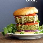 Easy Vegan Falafel Burger. Chickpea patties with tahini dressing and hummus make for a filling and flavorful burger. Vegan Soy-free Recipe. Can be made gluten-free | VeganRicha.com