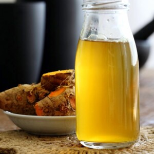 Ginger Turmeric Root Tea. Fresh Turmeric Root and ginger simmered with black pepper. Add sweetener of choice. Serve hot or chilled. Vegan Gluten-free Recipe | VeganRicha.com #glutenfree #veganricha #vegan