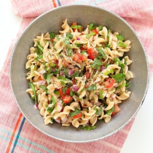 Tabbouleh Pasta Salad. Parsley, tomatoes, fusilli pasta dressed with olive oil, salt, pepper and lemon. Fresh Summer Salad. Vegan Soy-free Recipe. Can be made gluten-free with gf pasta. | VeganRicha.com #glutenfree #veganricha #vegan