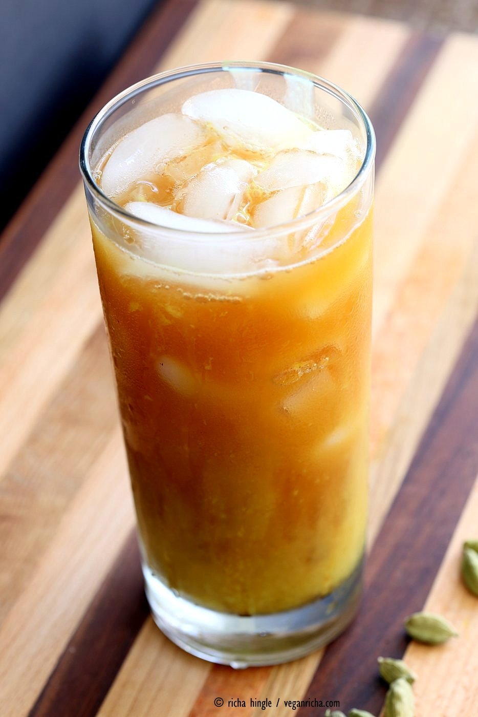 Cardamom Cinnamon Turmeric Iced Tea. Spiced Iced tea like Thai Iced tea with turmeric coconut milk and Indian masala chai spices and ginger. Golden Milk Iced Tea. Vegan Gluten-free Soy-free Recipe | VeganRicha.com