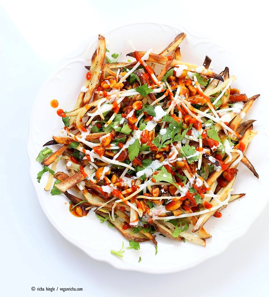 Baked Vietnamese fries. Baked Potato strips, loads of cilantro and basil, bean sprouts, nuts in sweet chile sauce, sriracha and vegan mayo! Banh mi Sandwich in fries form. Vegan Gluten-free Recipe. | VeganRicha.com