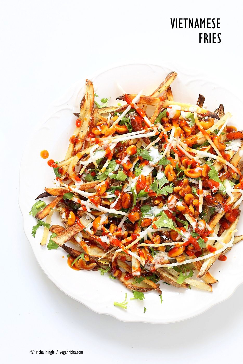 Baked Vietnamese fries. Baked Potato strips, loads of cilantro and basil, bean sprouts, nuts in sweet chile sauce, sriracha and vegan mayo! Banh mi Sandwich in fries form. Vegan Gluten-free Recipe. | VeganRicha.com