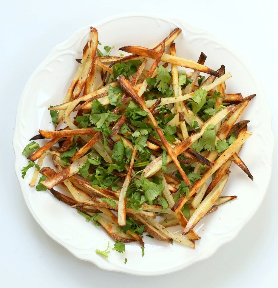 Baked Vietnamese fries. Baked Potato strips, loads of cilantro and basil, bean sprouts, nuts in sweet chile sauce, sriracha and vegan mayo! Banh mi Sandwich in fries form. Vegan Gluten-free Recipe. | VeganRicha.com