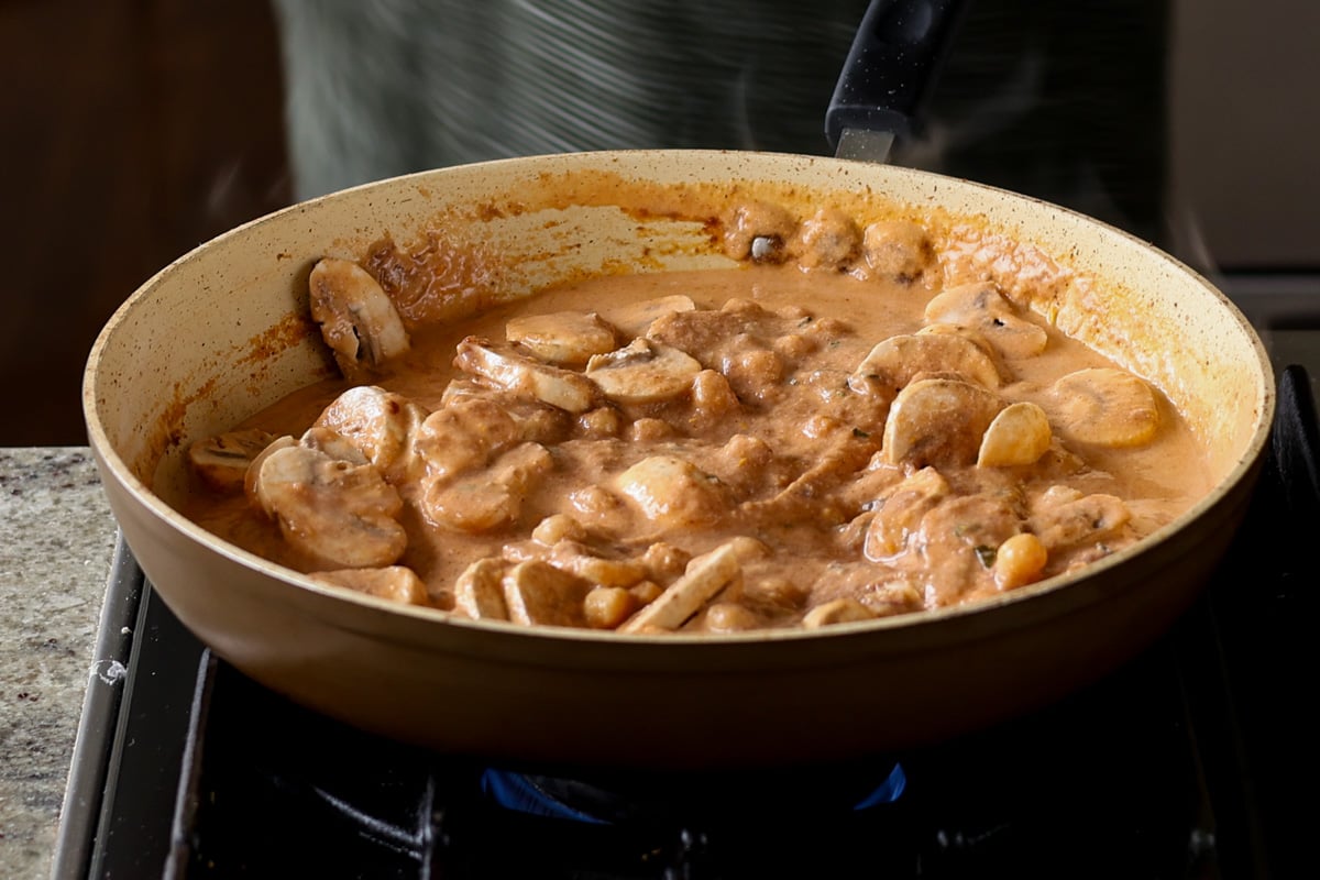 mushrooms and chickpea mixed into the matar masala