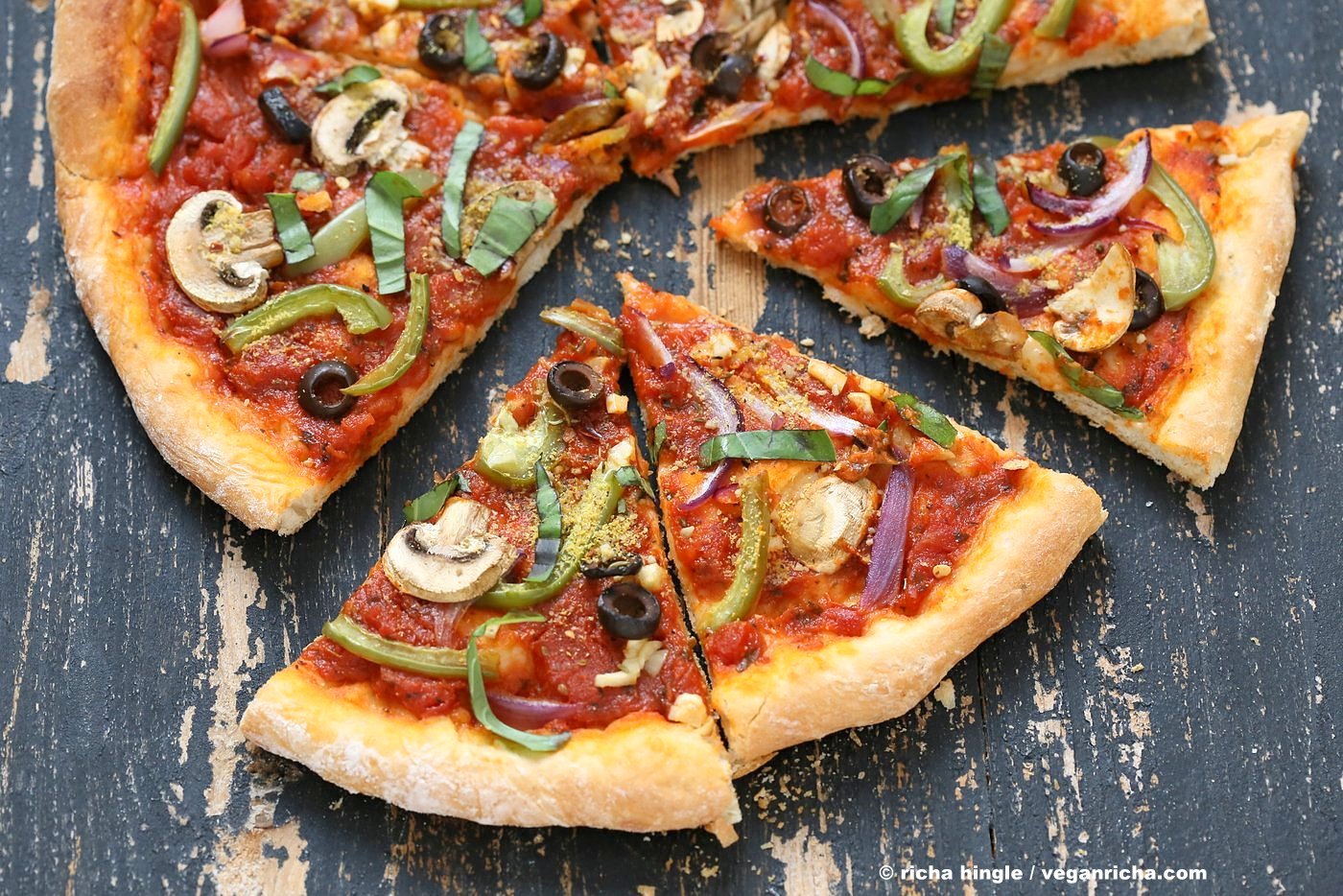 Easy Veggie Vegan Pizza with 20 minute Almost No Knead Crust! Pizza Sauce, Veggies, Mushrooms, Kalamata Olives baked to perfection. Dressed with Vegan Parmesan and fresh basil. Vegan Soy-free Recipe. Can be Nut-free | VeganRicha.com