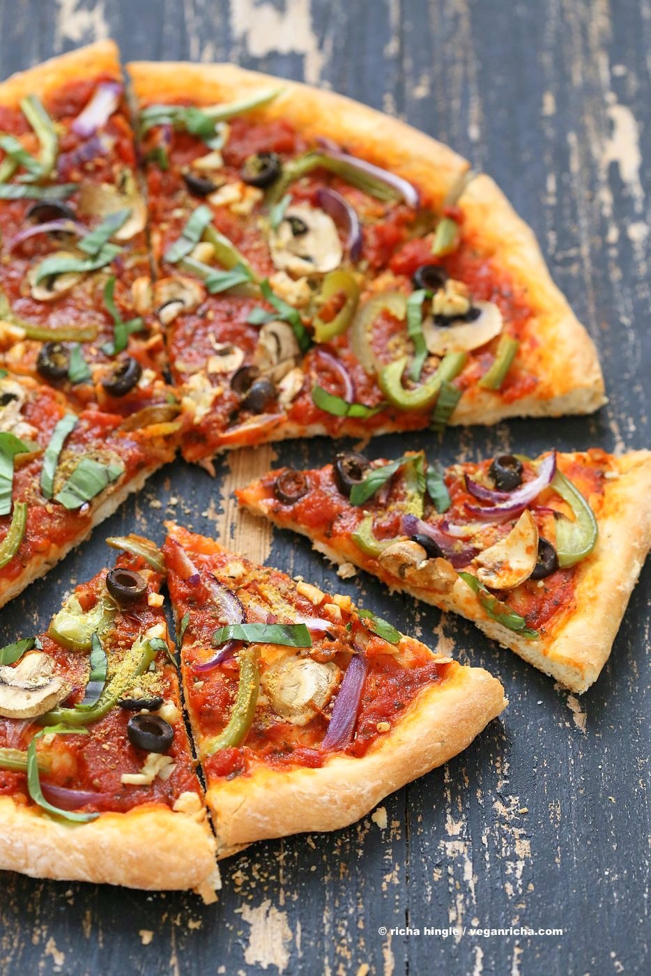 Easy Veggie Vegan Pizza with 20 minute Almost No Knead Crust! Pizza Sauce, Veggies, Mushrooms, Kalamata Olives baked to perfection. Dressed with Vegan Parmesan and fresh basil. Vegan Soy-free Recipe. Can be Nut-free | VeganRicha.com