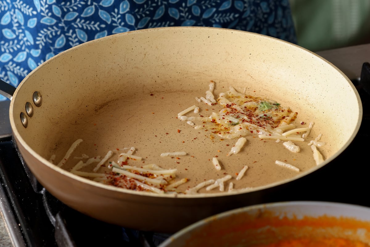 toasting vegan cheese shreds in the pan