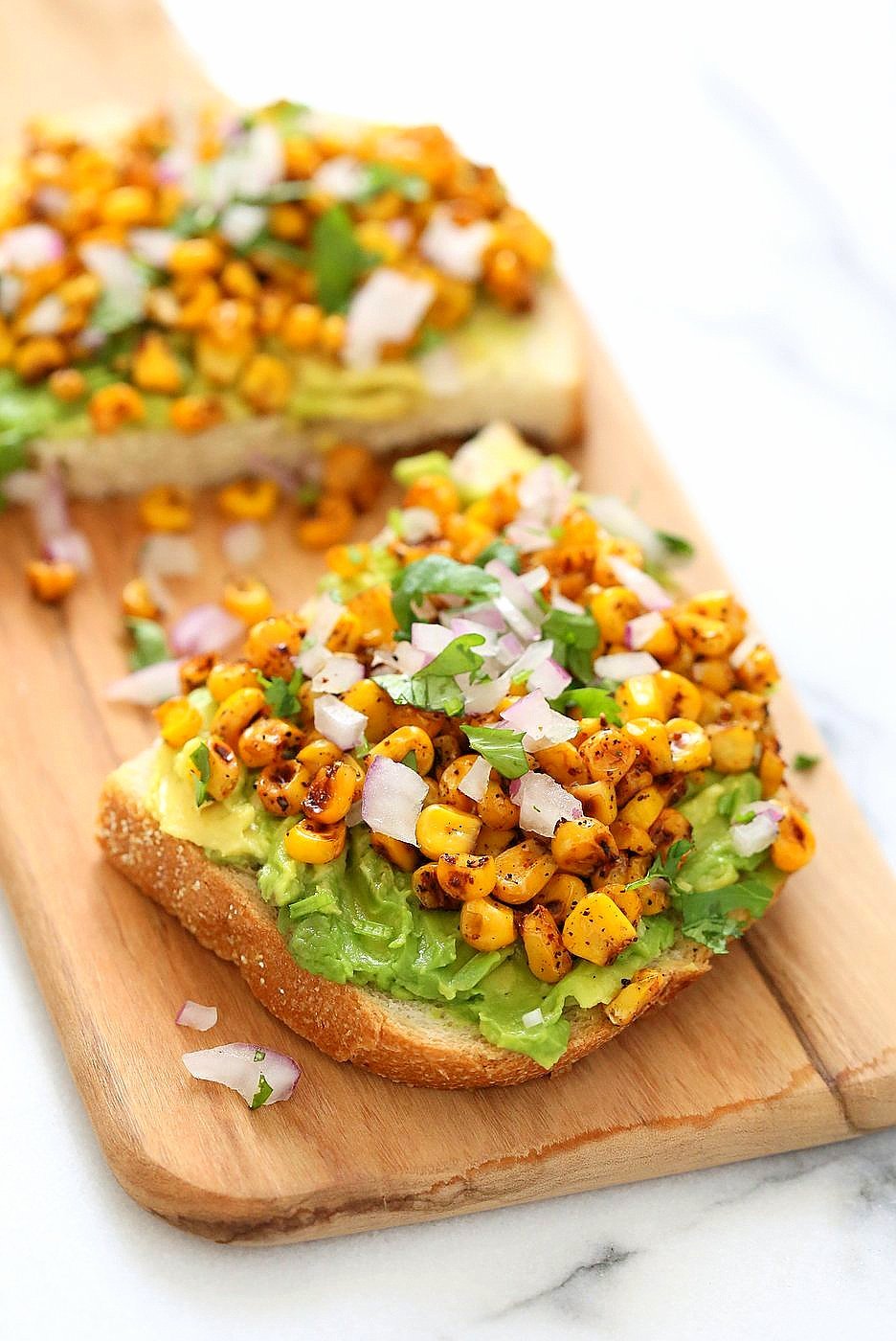 Chipotle Roasted Corn Avocado Toast. Summer corn roasted with Smoked Paprika, Chipotle and black pepper and layered over Avocado Toast. Vegan Avocado Recipe.| VeganRicha.com