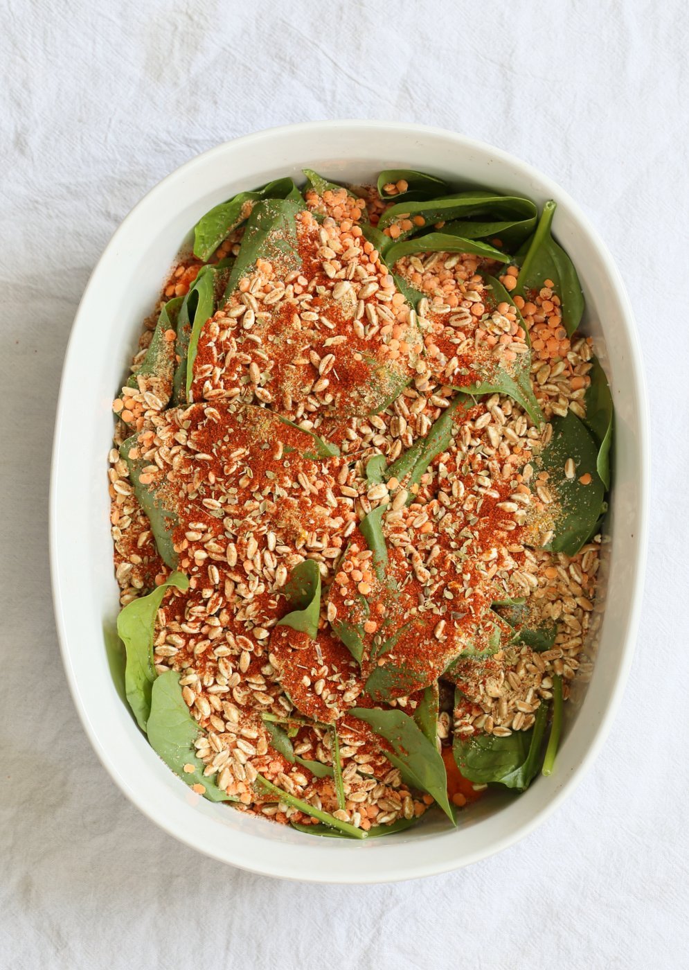BBQ Lentil Farro Cauliflower Casserole. BBQ Casserole with Red Lentils, Farro, Veggies, Spinach, Cauliflower all layered and baked. Amazing Flavors! #Vegan #Glutenfree #Nutfree #Recipe. Can be soyfree #veganricha | VeganRicha.com
