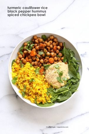 Turmeric Cauliflower Rice, Spiced Chickpeas or lentils, Black pepper hummus and Greens bowl. Amazing Flavors for any meal. Ready within 25 minutes. Vegan Gluten-free Soy-free Recipe | VeganRicha.com