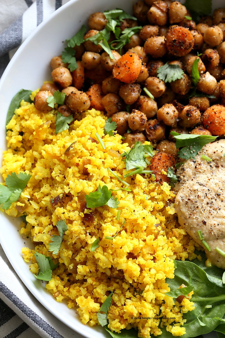 Turmeric Cauliflower Rice, Spiced Chickpeas or lentils, Black pepper hummus and Greens bowl. Amazing Flavors for any meal. Ready within 25 minutes. Vegan Gluten-free Soy-free Recipe | VeganRicha.com
