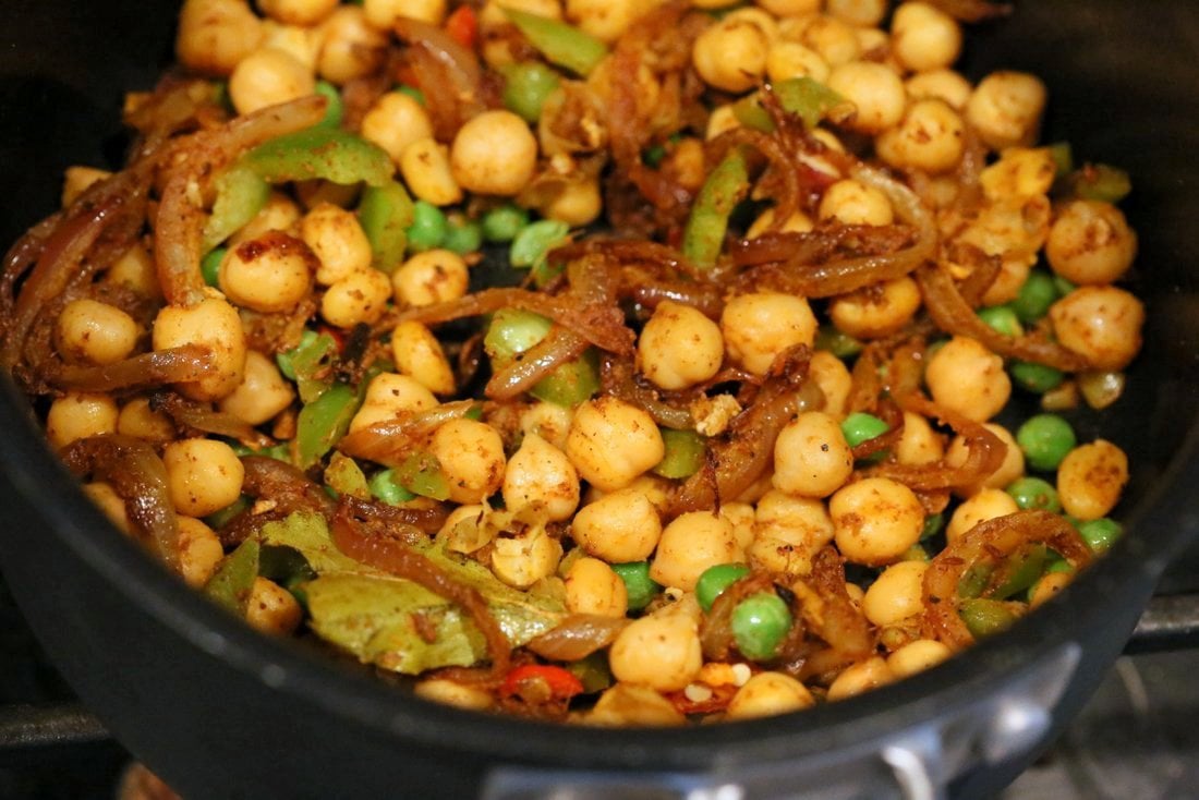 Chickpea Cauliflower Rice Biryani. 1 pot 30 Minute Meal with Veggies, Chickpeas, Spices, and Cauliflower Rice. Served with tomato raita. Vegan Gluten-free Soy-free Grain-free Recipe