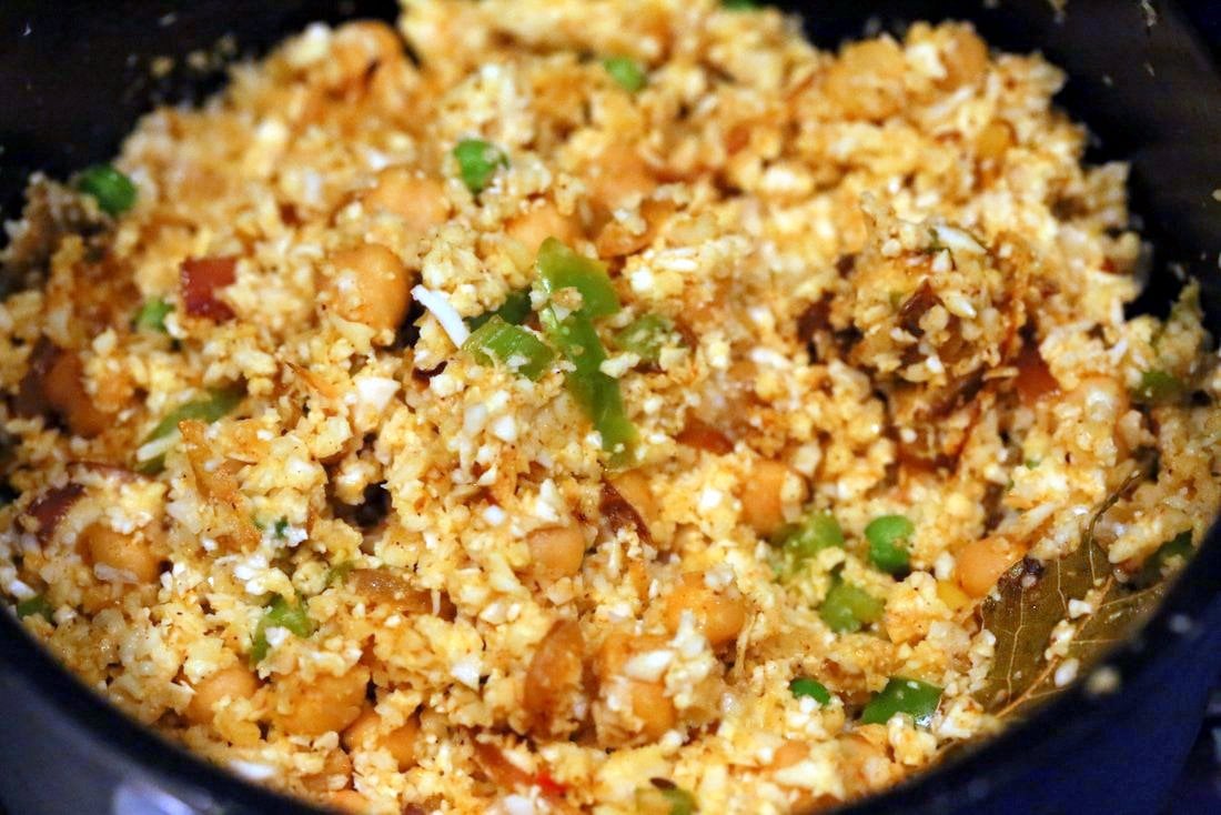 Chickpea Cauliflower Rice Biryani. 1 pot 30 Minute Meal with Veggies, Chickpeas, Spices, and Cauliflower Rice. Served with tomato raita. Vegan Gluten-free Soy-free Grain-free Recipe