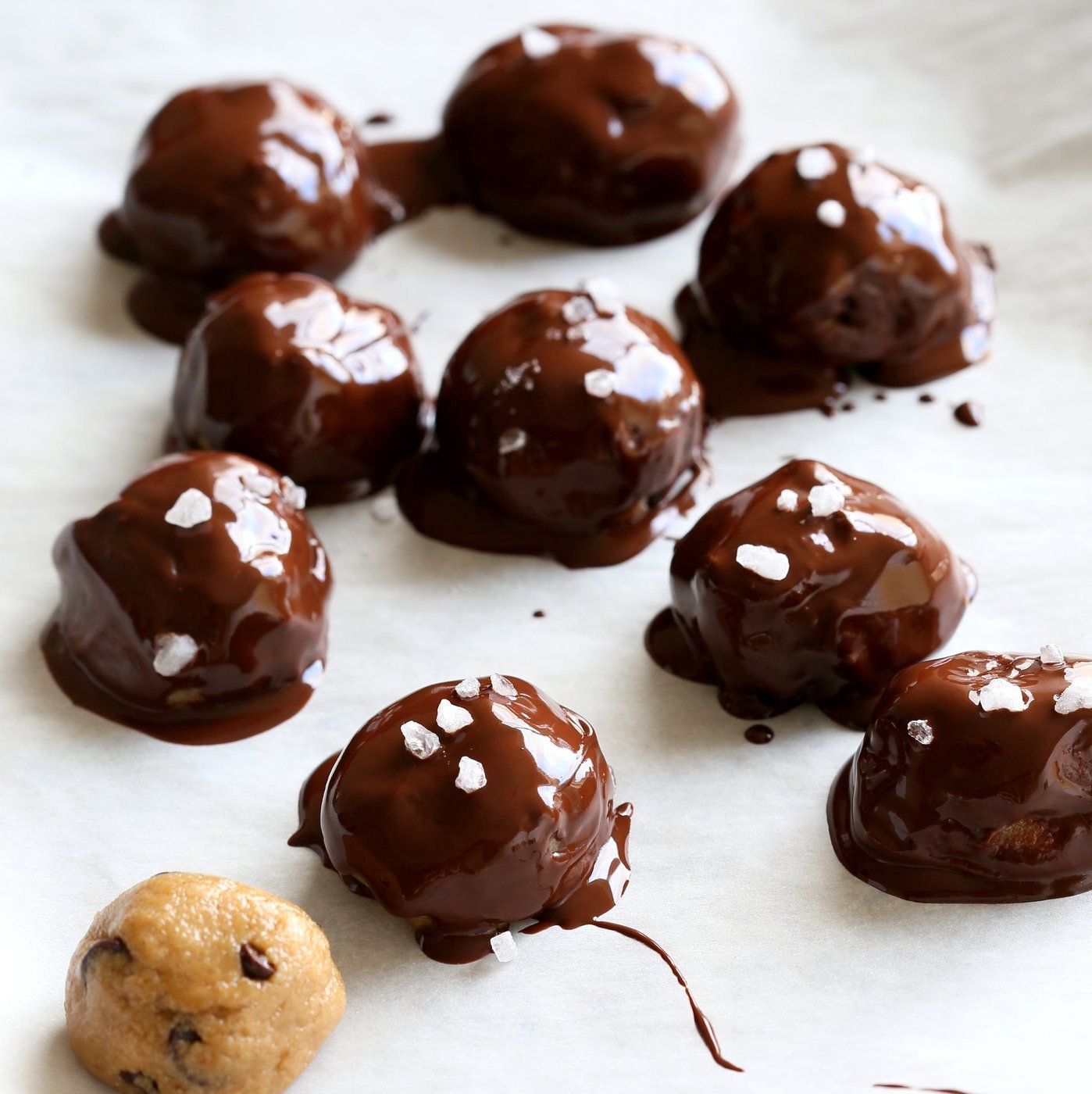 Cookie Dough Truffles. Fudgy Cookie dough coated in melted chocolate and topped with coarse sea salt. Vegan Gluten-free Recipe | VeganRicha.com