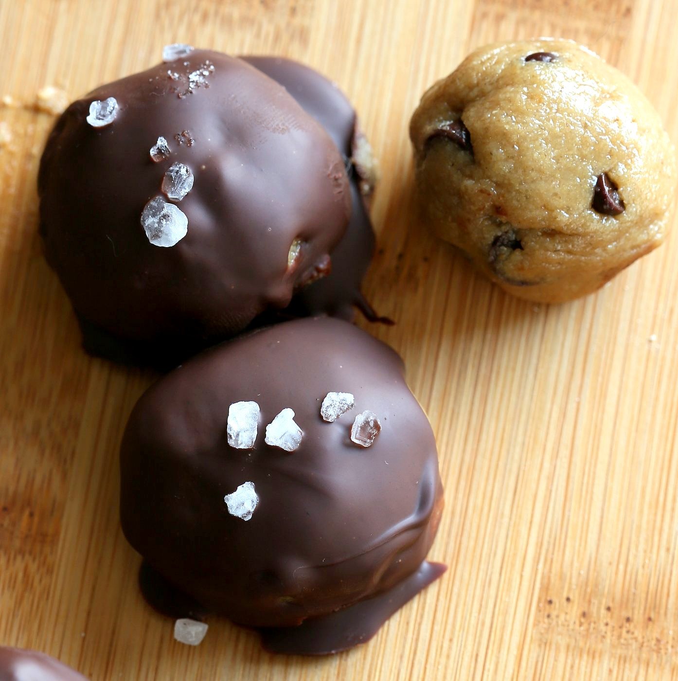 Cookie Dough Truffles. Fudgy Cookie dough coated in melted chocolate and topped with coarse sea salt. Vegan Gluten-free Recipe | VeganRicha.com