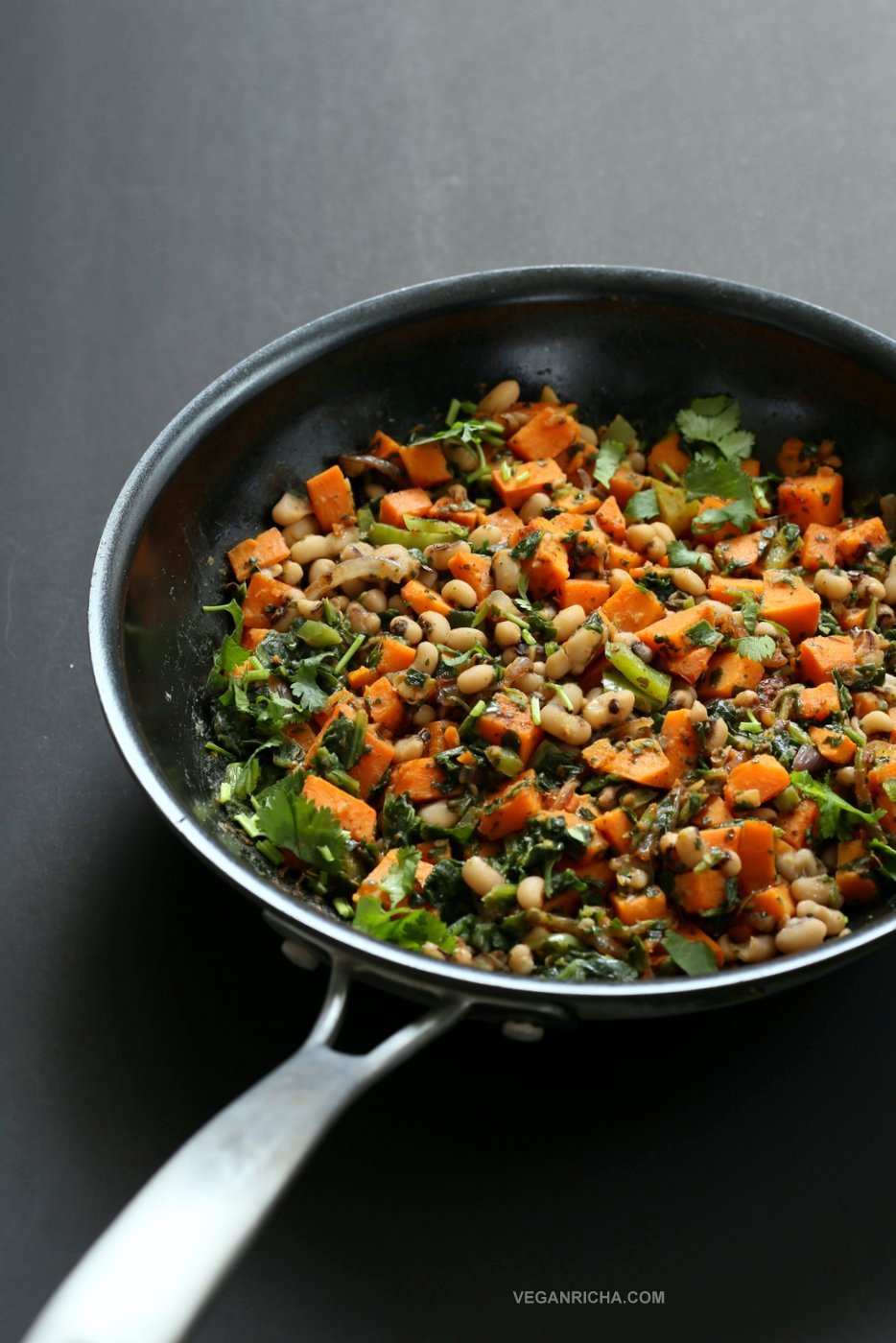 Bring in the new year with this plentiful Black eyed pea and Sweet Potato Hash with Harissa Spice. Ready in 20 minutes. Serve over toast with a creamy dressing or avocado. #Vegan #Glutenfree #Soyfree #Recipe #veganricha | VeganRicha.com
