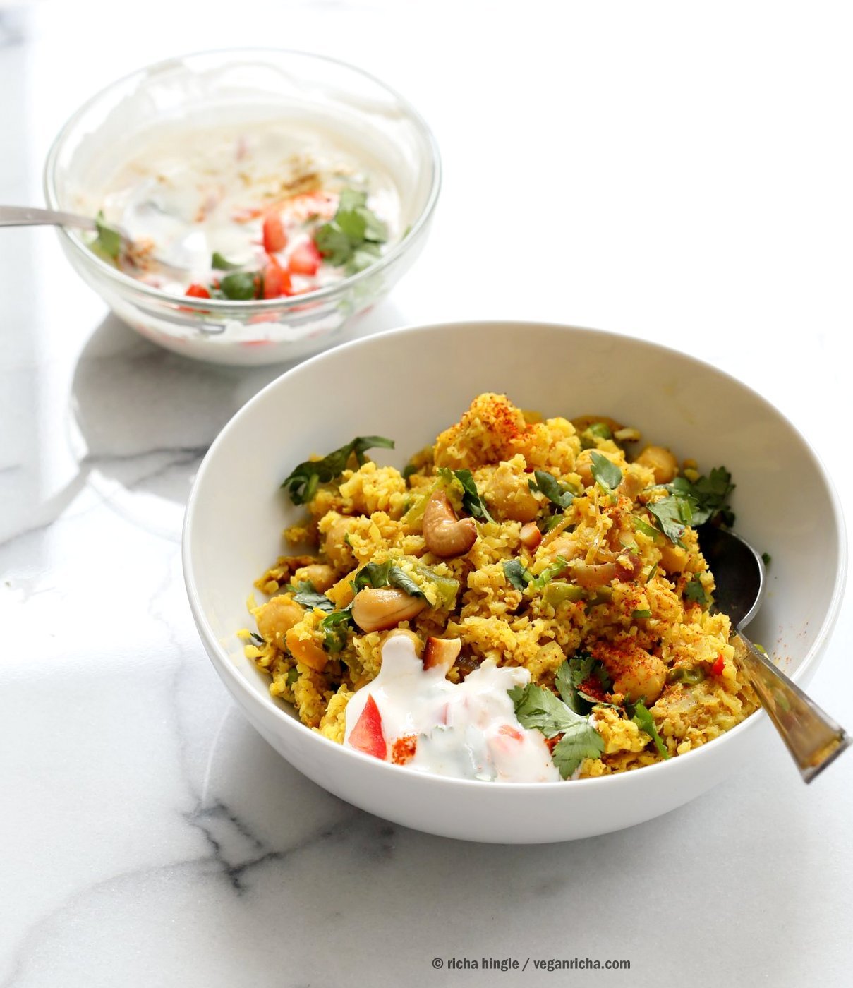 Chickpea Cauliflower Rice Biryani. 1 pot 30 Minute Meal with Veggies, Chickpeas, Spices, and Cauliflower Rice. Served with tomato raita. Vegan Gluten-free Soy-free Grain-free Recipe |VeganRicha.com