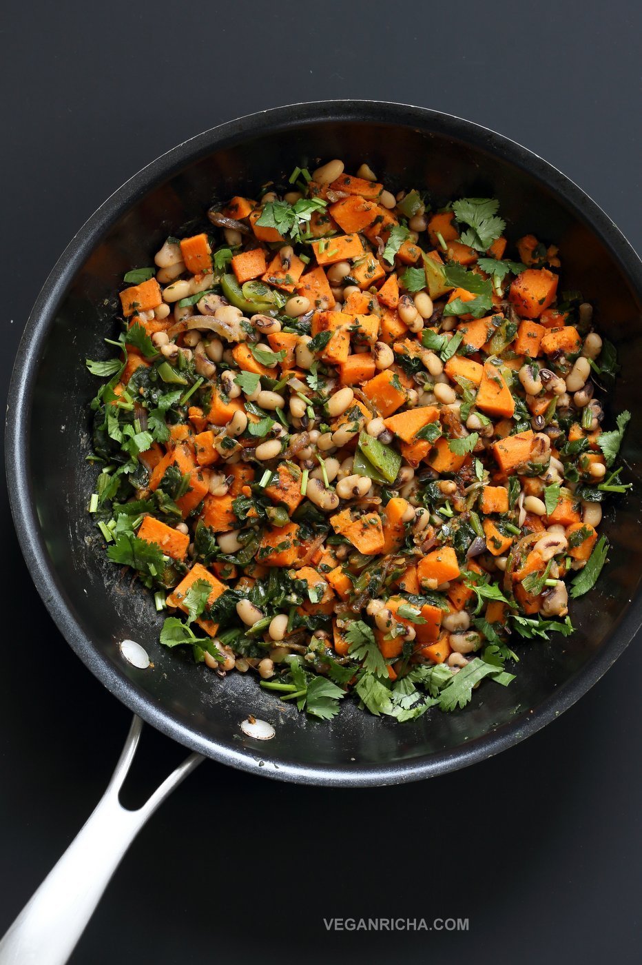 Bring in the new year with this plentiful Black eyed pea and Sweet Potato Hash with Harissa Spice. Ready in 20 minutes. Serve over toast with a creamy dressing or avocado. #Vegan #Glutenfree #Soyfree #Recipe #veganricha | VeganRicha.com