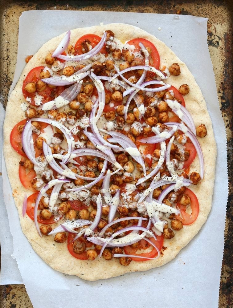 Ethiopian Berbere Chickpea Pizza with Tahini Garlic Dressing. Amazingly flavorful pizza. Dress with tahini dressing, vegan ranch or other creamy dressing. Vegan Soyfree Nut-free Recipe. Gluten-free Crust option. | VeganRicha.com
