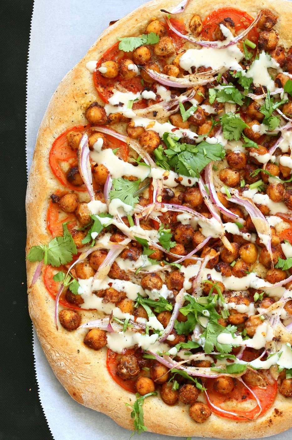 Ethiopian Berbere Chickpea Pizza with Tahini Garlic Dressing. Amazingly flavorful pizza. Dress with tahini dressing, vegan ranch or other creamy dressing. Vegan Soyfree Nut-free Recipe. Gluten-free Crust option. | VeganRicha.com