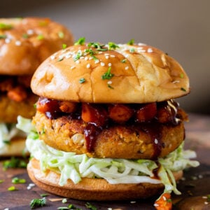 Peanut white bean burger topped with roasted sweet potato, cabbage and burger buns