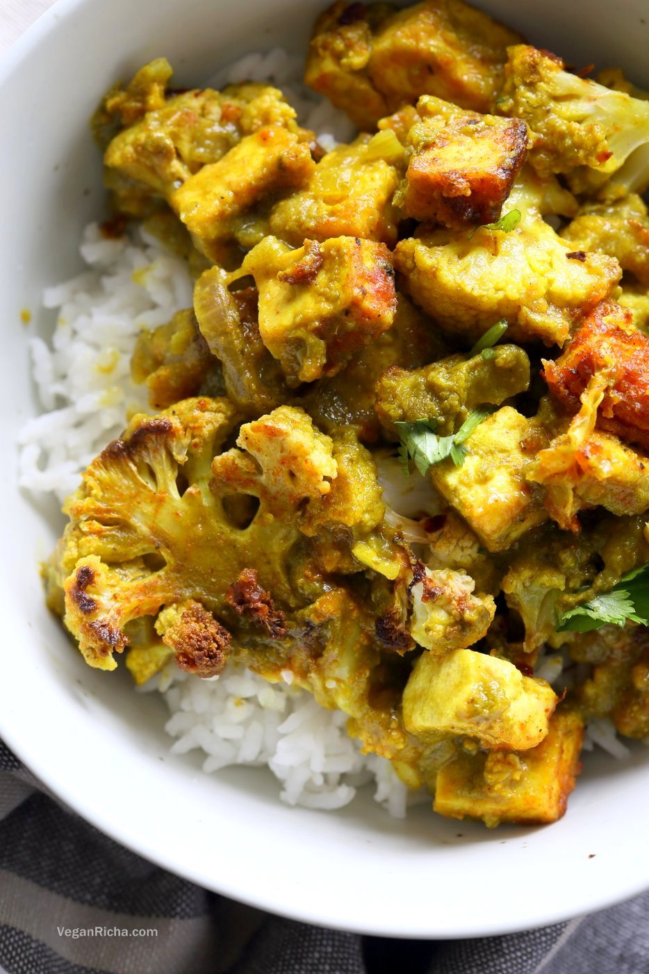 Spiced Cauliflower and Tofu in Green Masala Sauce. Baked Cauliflower and Tofu in green cilantro sauce. The sauce paste can be made ahead and stored. Vegan Gluten-free Nut-free Recipe. Can be soy-free with chickpea tofu or chickpeas or beans or other veggies. | VeganRicha.com