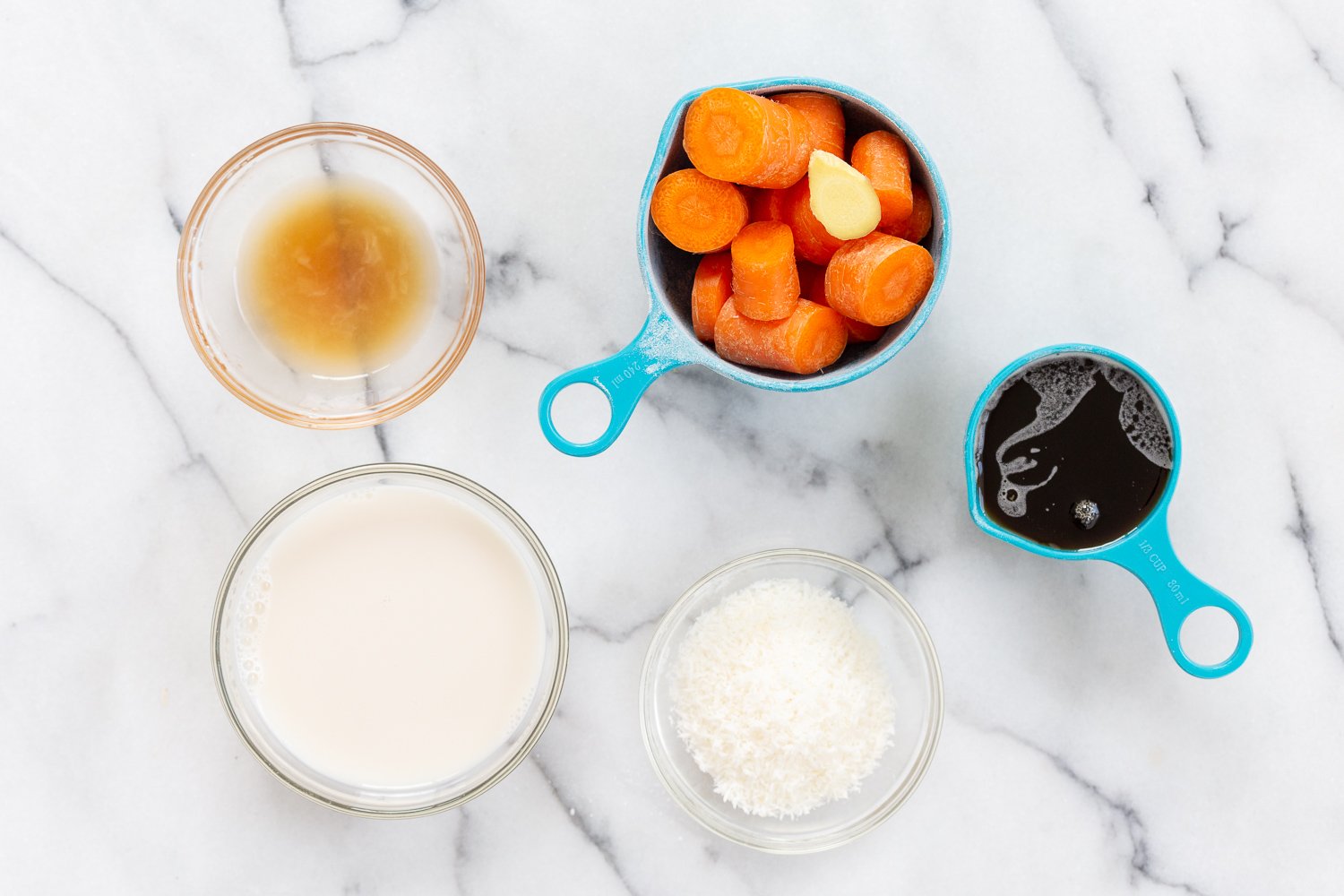 Wet Ingredients for Our Vegan Turmeric Carrot Muffins in bowls