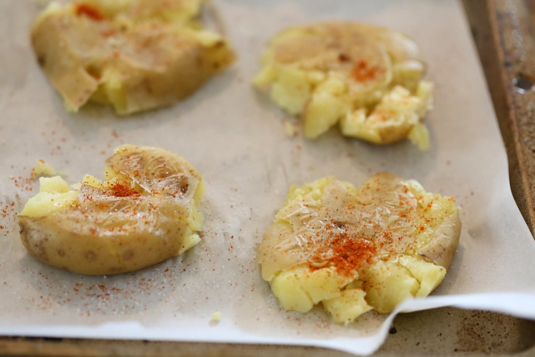 Indian Spiced Smashed Potatoes with Mustard Ginger Tempering. Bonda like Samosa is a spiced potato snack. These smashed potatoes are topped with Bonda style tempering of ginger, chile, turmeric and mustard seeds. Vegan Gluten-free Recipe | VeganRicha.com