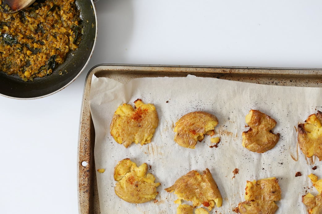 Indian Spiced Smashed Potatoes with Mustard Ginger Tempering. Bonda like Samosa is a spiced potato snack. These smashed potatoes are topped with Bonda style tempering of ginger, chile, turmeric and mustard seeds. Vegan Gluten-free Recipe | VeganRicha.com