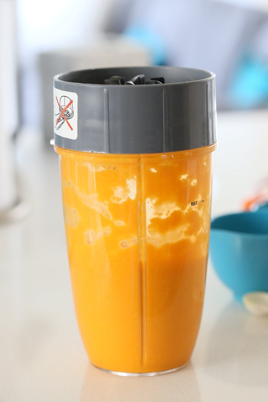 WEt ingredients blended in a blender for Our Vegan Turmeric Carrot Muffins