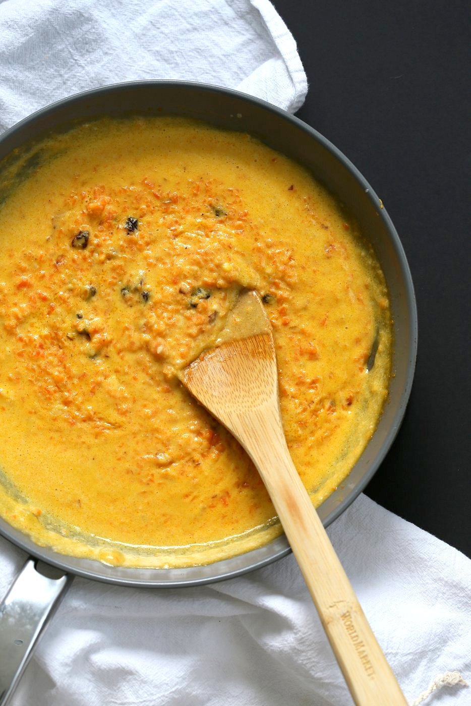 Carrot Pudding with Cardamom - Carrot Kheer Recipe. Shredded Carrots slow cooked with almond milk, roasted nuts and cardamom. Serve as is or top with toasted nuts, seeds and chia. Vegan Gluten-free Soy-free Nut-free option | VeganRicha.com