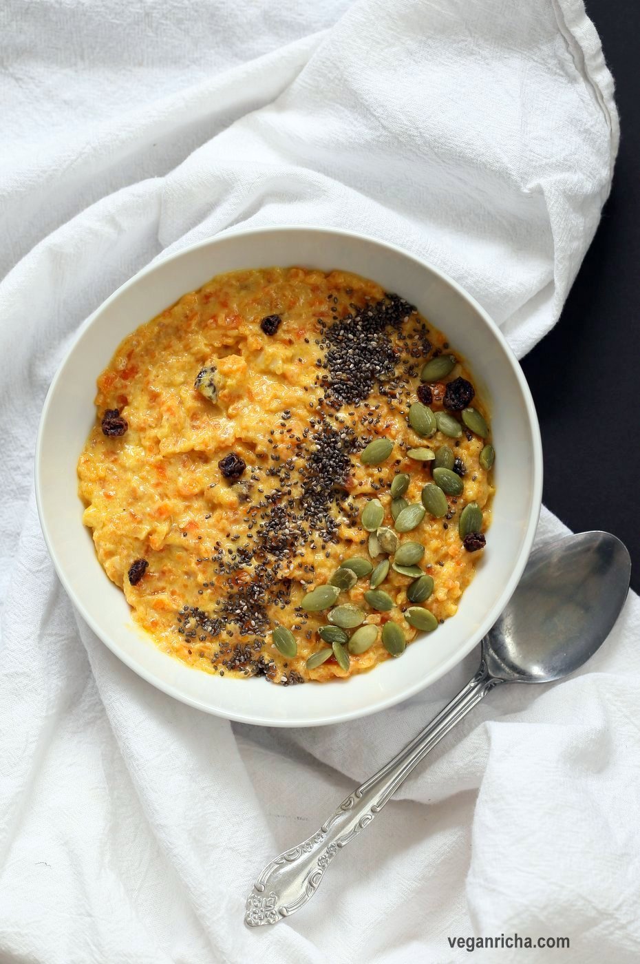 Carrot Pudding with Cardamom - Carrot Kheer Recipe. Shredded Carrots slow cooked with almond milk, roasted nuts and cardamom. Serve as is or top with toasted nuts, seeds and chia. Vegan Gluten-free Soy-free Nut-free option | VeganRicha.com