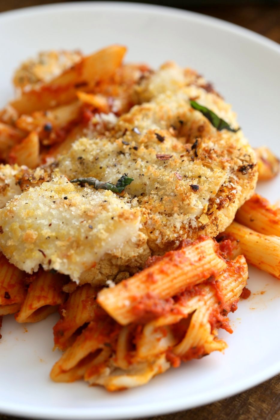 Vegan Cauliflower Parmesan Pasta Bake. Pasta, marinara sauce, Crispy Cauliflower slices coated in breadcrumbs and spices, and vegan mozzarella. Soy-free Recipe. Can be gluten-free | VeganRicha.com