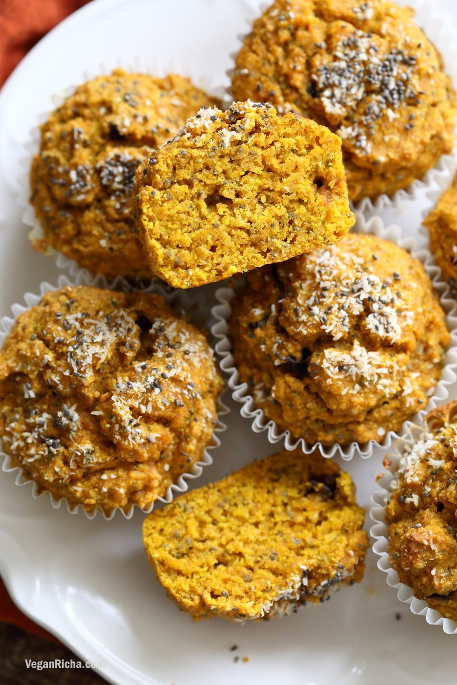 Vegan Turmeric Carrot Muffins. These sunshine muffins have carrots, dry or fresh turmeric, fresh ginger and chia seeds. Coconut rounds up the flavor for a caramelized carrot ginger turmeric profile. Add nuts or dried fruit of choice to these Turmeric muffins. No added sugar or oil needed. #Vegan #Soyfree #Nutfree #Recipe #TurmericCarrotMuffins #VeganRicha Gluten-free option| VeganRicha.com
