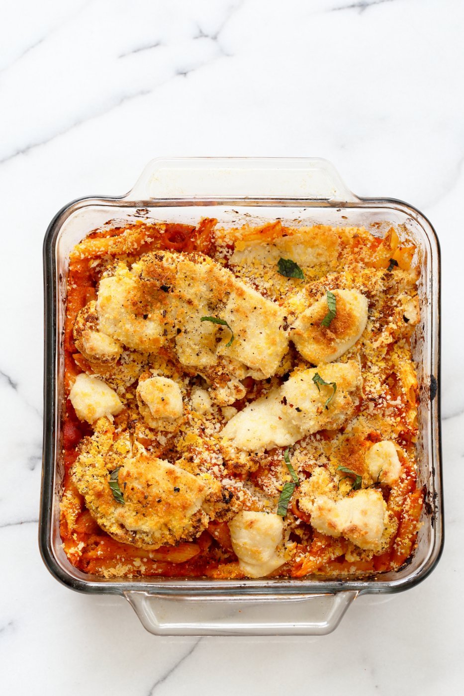 Vegan Cauliflower Parmesan Pasta Bake. Pasta, marinara sauce, Crispy Cauliflower slices coated in breadcrumbs and spices, and vegan mozzarella. Soy-free Recipe. Can be gluten-free | VeganRicha.com