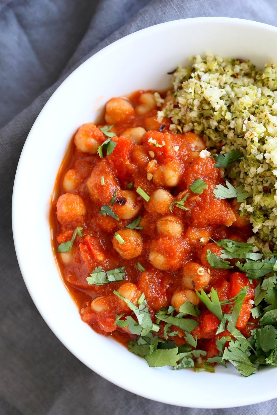 Flavorful Spanish Chickpea Stew with Cumin scented Cauliflower Broccoli Rice. Smoky tomatoey Chickpea Stew can be served over rice or grains or cauliflower or broccoli rice. Vegan Gluten-free Nut-free Grain-free Soy-free Recipe | VeganRicha.com